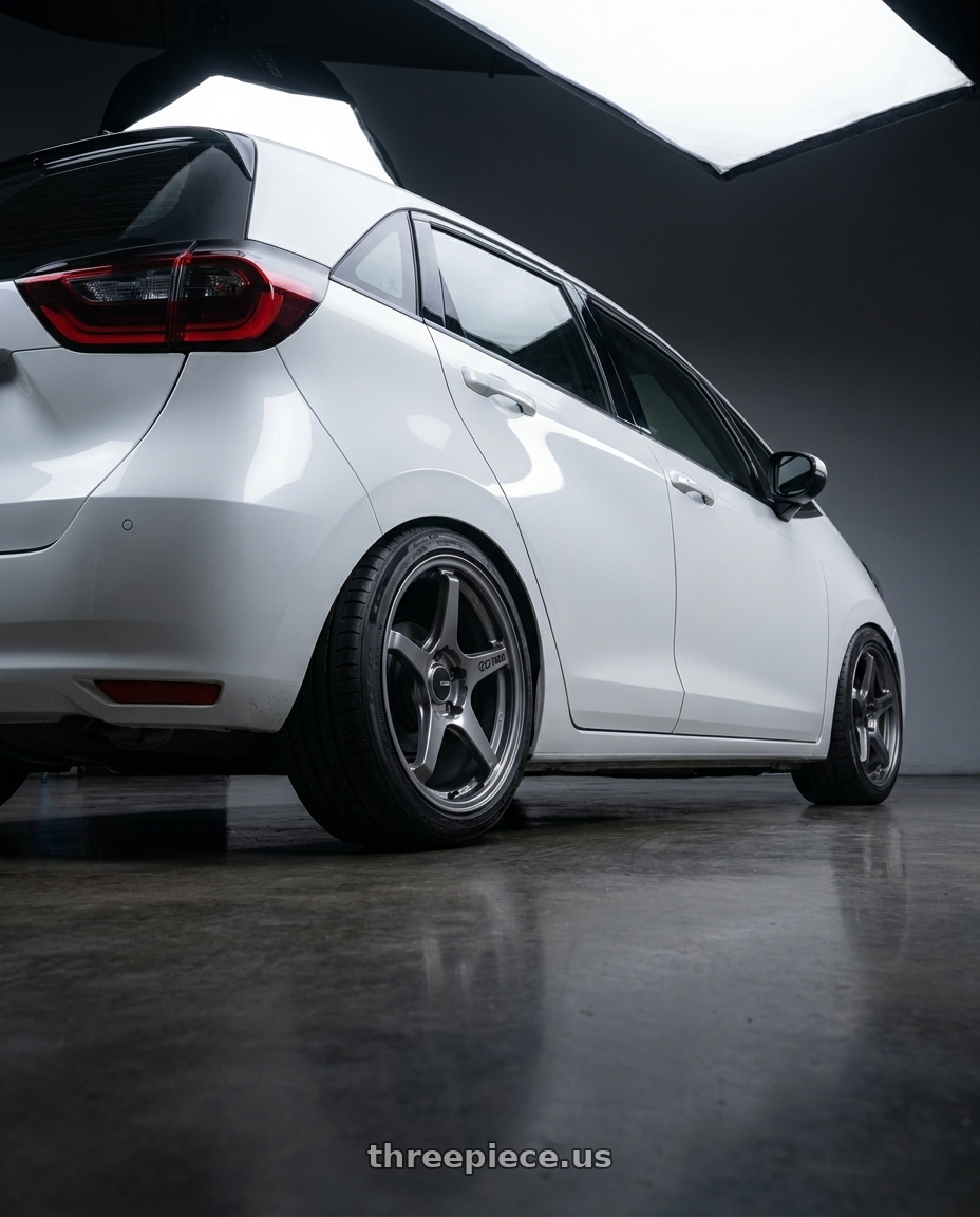 2025 honda fit4 with Enkei TS-5 5x114.3 17x8+40 Storm Grey wheels rear three quarter view square tires