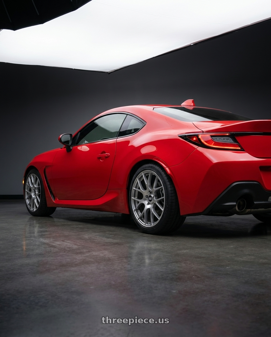 2026 Subaru brz with Enkei Raijin 5x100 18x8.5+45 Hyper Silver wheels rear three quarter view square tires
