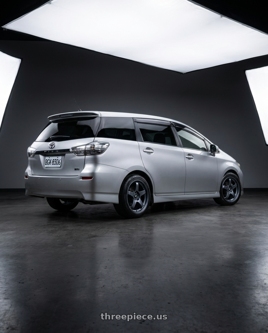 2010 Toyota wish with MST Wheels CR 5X114.3 18X8.5 +35 Matte Gunmetal wheels rear three quarter view square tires