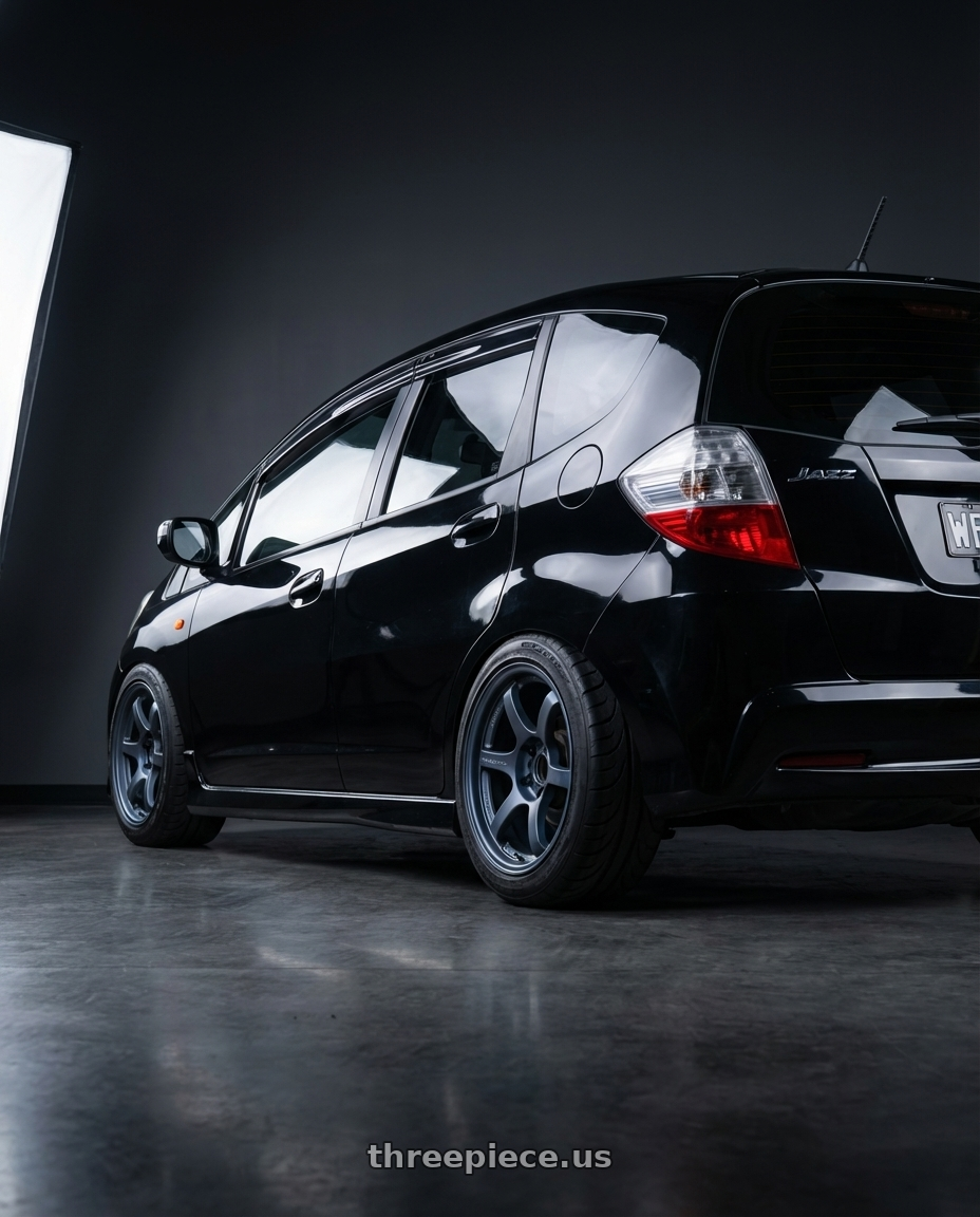 2008 Honda Jazz VTi-S with Gram Lights 57DR 4x100 15x8.0+28 Gun Blue wheels rear three quarter view meaty tires