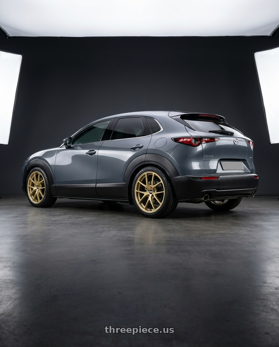 2020 Mazda CX30 with BBS RI-A 5x114.3 18x8.5 +35 Gold wheels rear three quarter view square tires