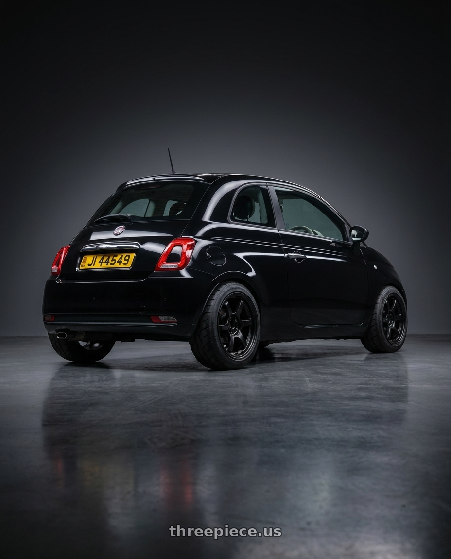 2018 Fiat 500 Pop, black with Gram Lights 57DR 4x100 15x8.0+28 Semi Gloss Black wheels rear three quarter view meaty tires