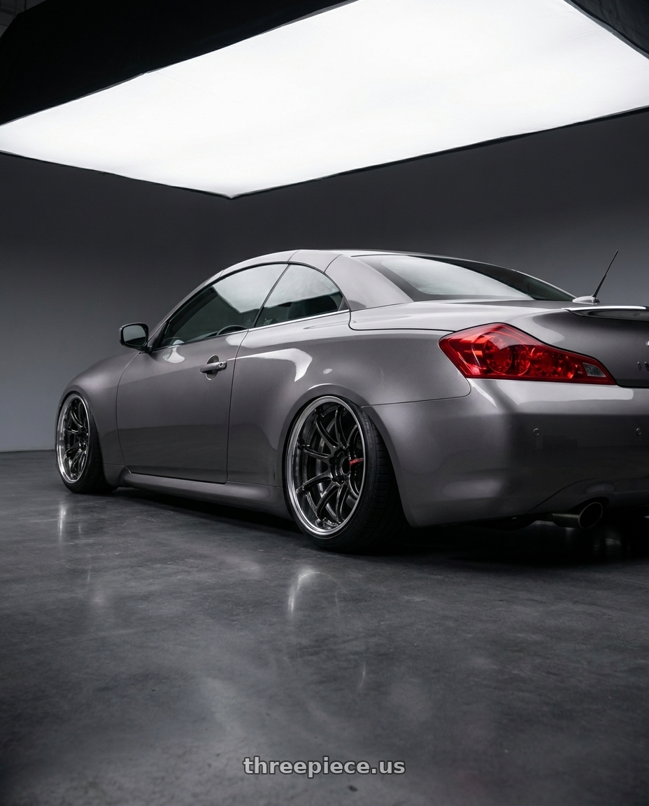 2009 G37 convertible with Work Zr10 2P 5x120 18x10.0 +38 Glim Black wheels rear three quarter view slight stretch tires