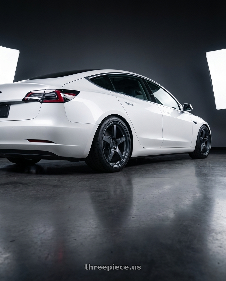 2023 Tesla Model 3 with Gram Lights 57CR 5x114.3 19x8.5+35 Gunblue II wheels rear three quarter view square tires