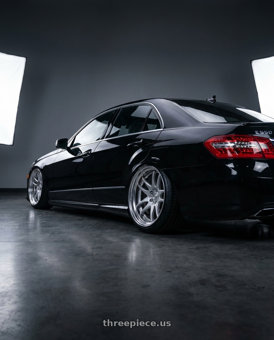 2010 Benz E550 with Work Cr 2P 5x105 20x12.0 +18 GT Silver wheels rear three quarter view slight stretch tires