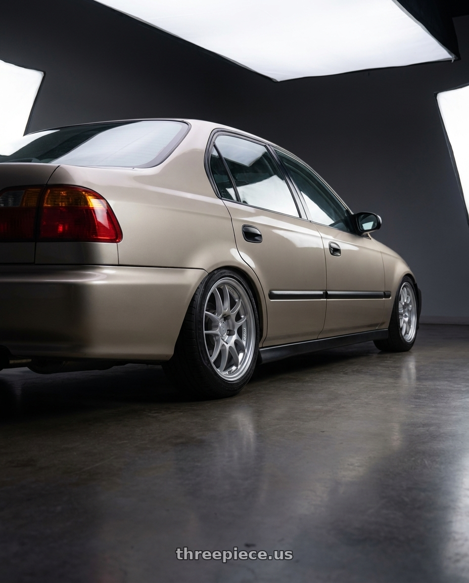 2000 honda civic DX sedan with Enkei PF01 4x100 16x7+43 Silver wheels rear three quarter view slight stretch tires