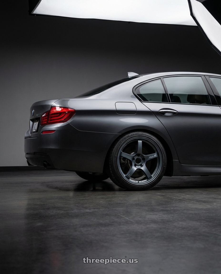 2016 BMW 5 Series F10 with Gram Lights 57CR 5x120 19x8.5+35 Gunblue II wheels rear three quarter view square tires