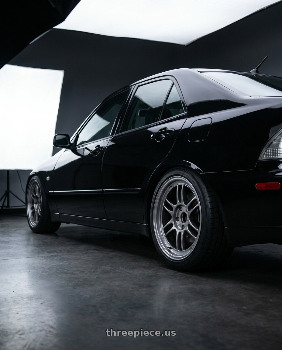 2001 Lexus IS300 with Enkei RPF1 5x114.3 17x8+45 SBC wheels rear three quarter view square tires