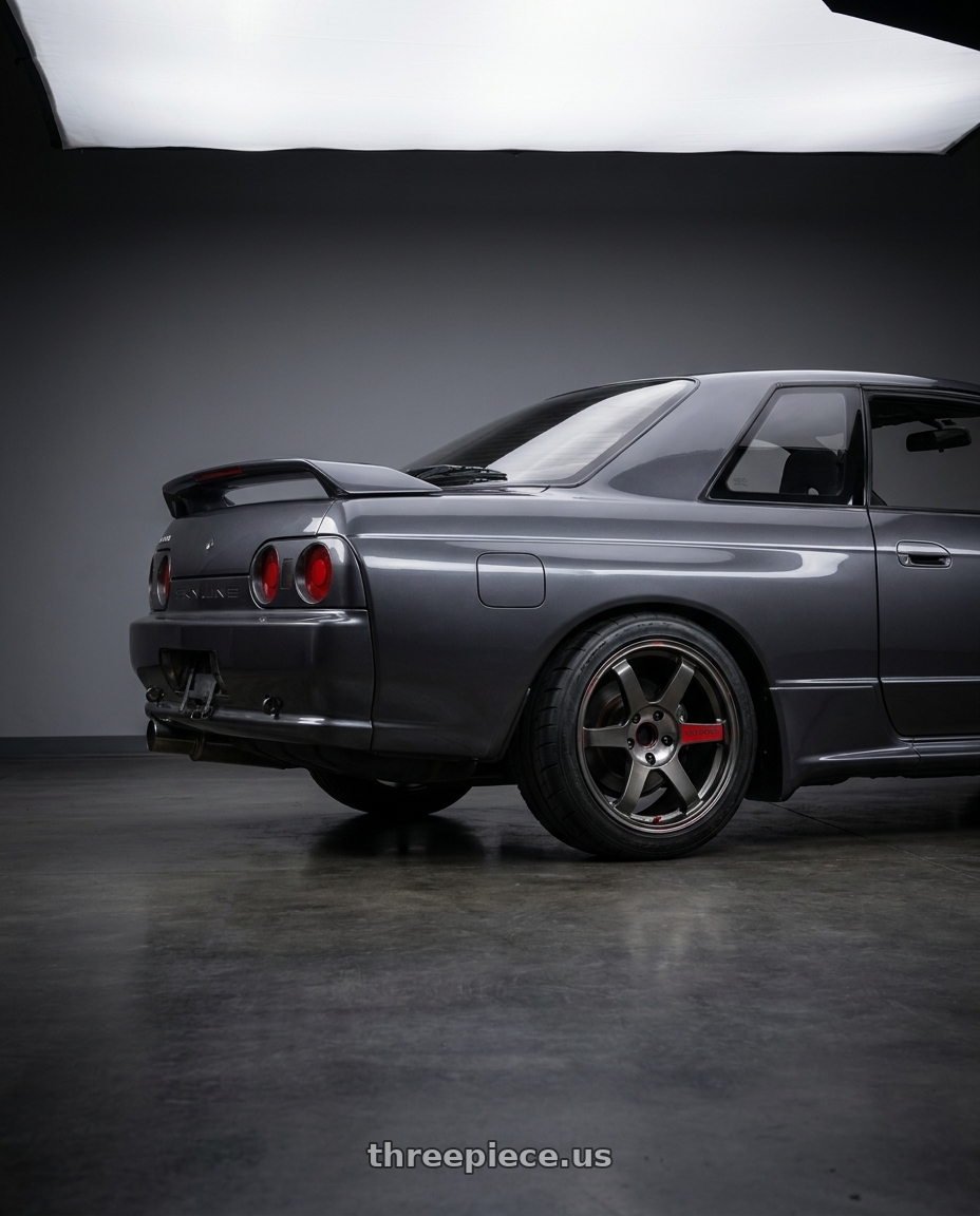 1992 Nissan Skyline R32 GTS-T Type M with Volk Racing TE37 Saga SL 5x114.3 18x9.5+22 Pressed Graphite wheels rear three quarter view square tires