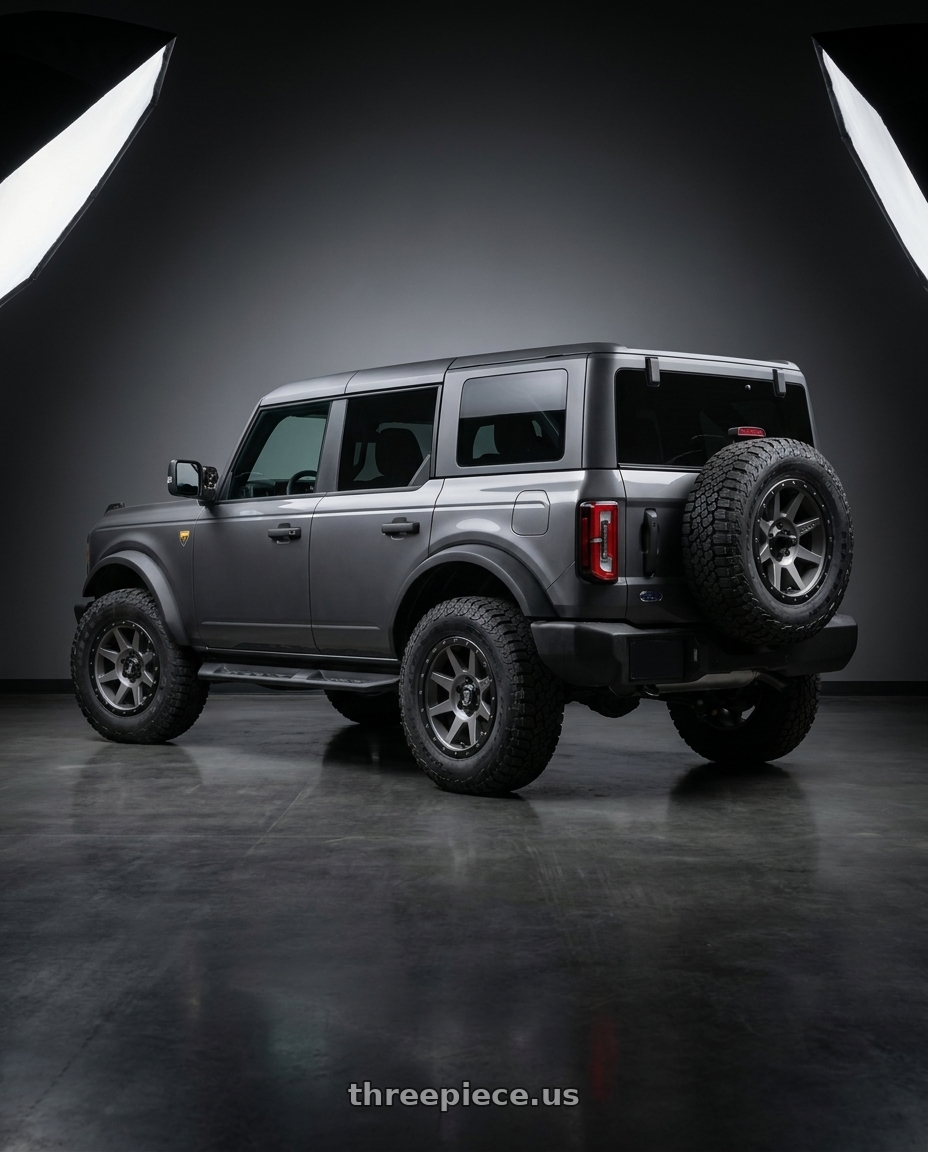 2023 Ford Bronco with Icon Alloys REBOUND 6x139.7 17X8.5+25 TITANIUM wheels rear three quarter view square tires