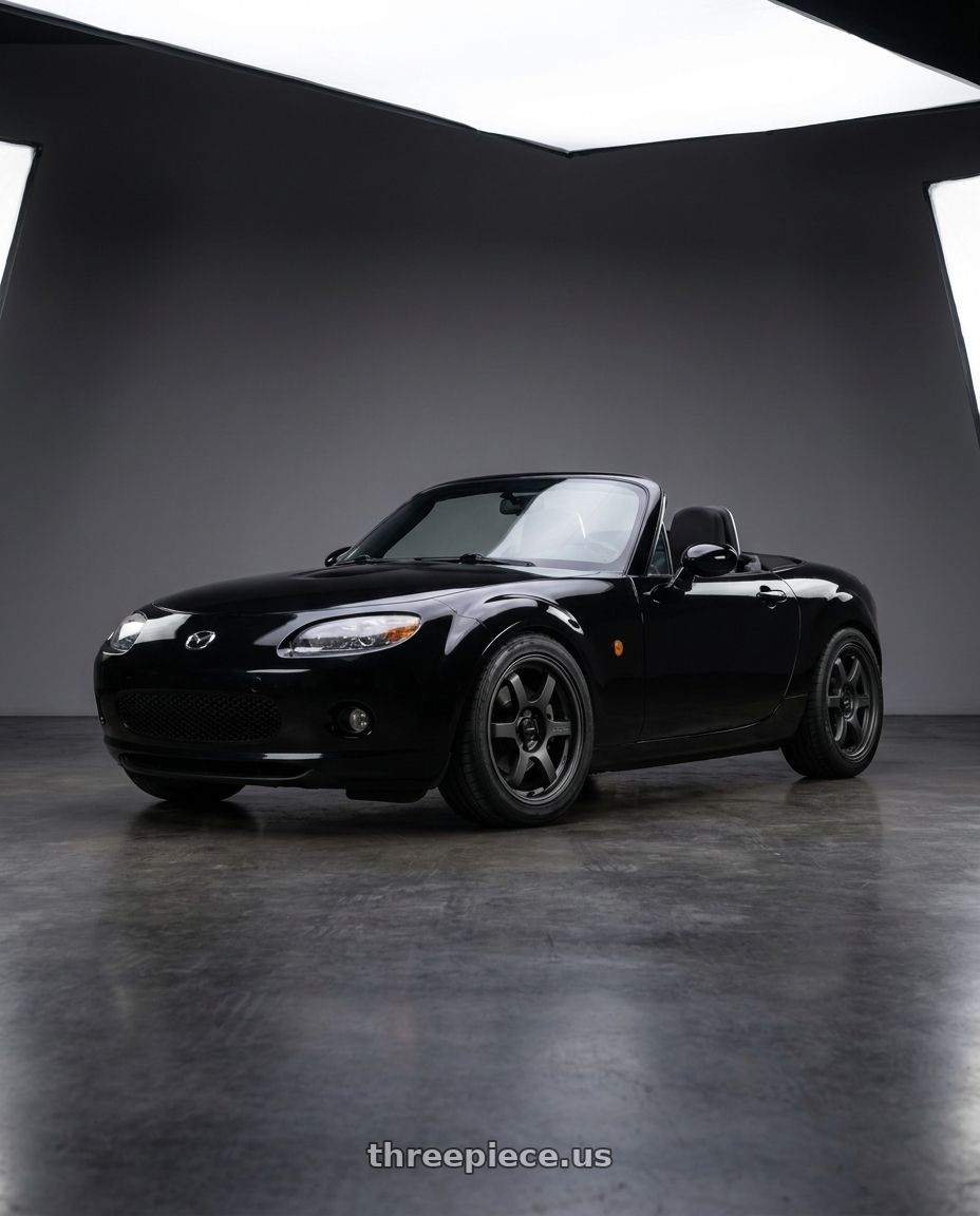 2006 Mazda MX-5 Miata with Gram Lights 57DR-X2 5x114.3 16x7+32 Black Graphite wheels front three quarter view stock stance
