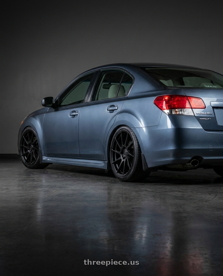 2014 Subaru Legacy 2 5 with Aodhan AH09 5x100 18x8.5 +35 Matte Black wheels rear three quarter view square tires