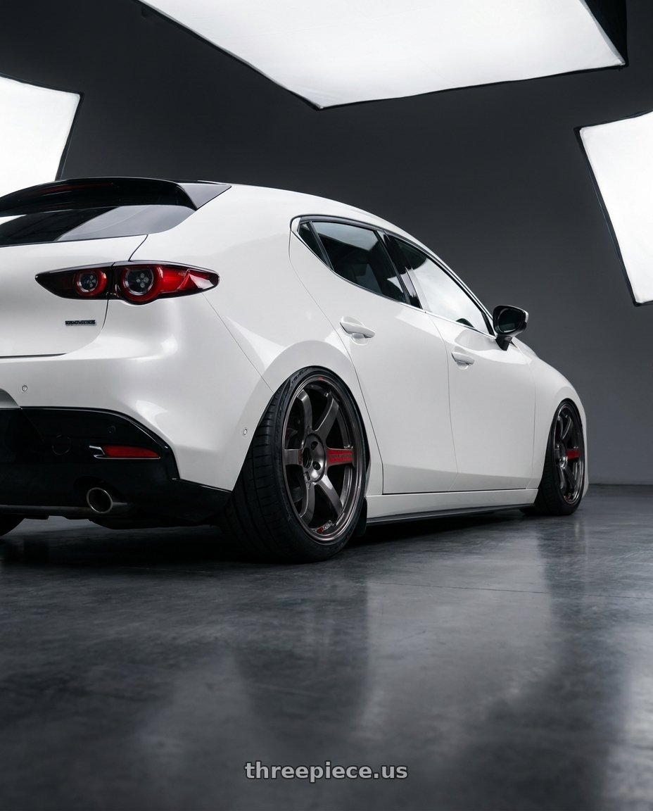 2025 Mazda 3 with Volk Racing TE37 Saga SL 5x120 18x9.5+20 Pressed Graphite wheels rear three quarter view square tires