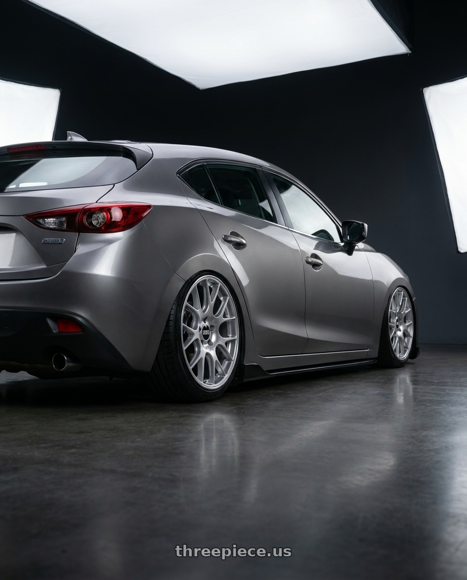 2013 Mazda3 5d with BBS CH-R 5x130 19x12 +45 Brilliant Silver Polished Rim Protector wheels rear three quarter view slight stretch tires