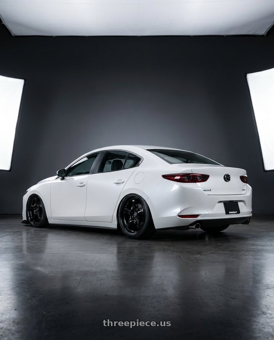2022 Mazda3 White with WedsSport RN-05M 5x114.3 19x9.5+38 Gloss Black wheels rear three quarter view slight stretch tires