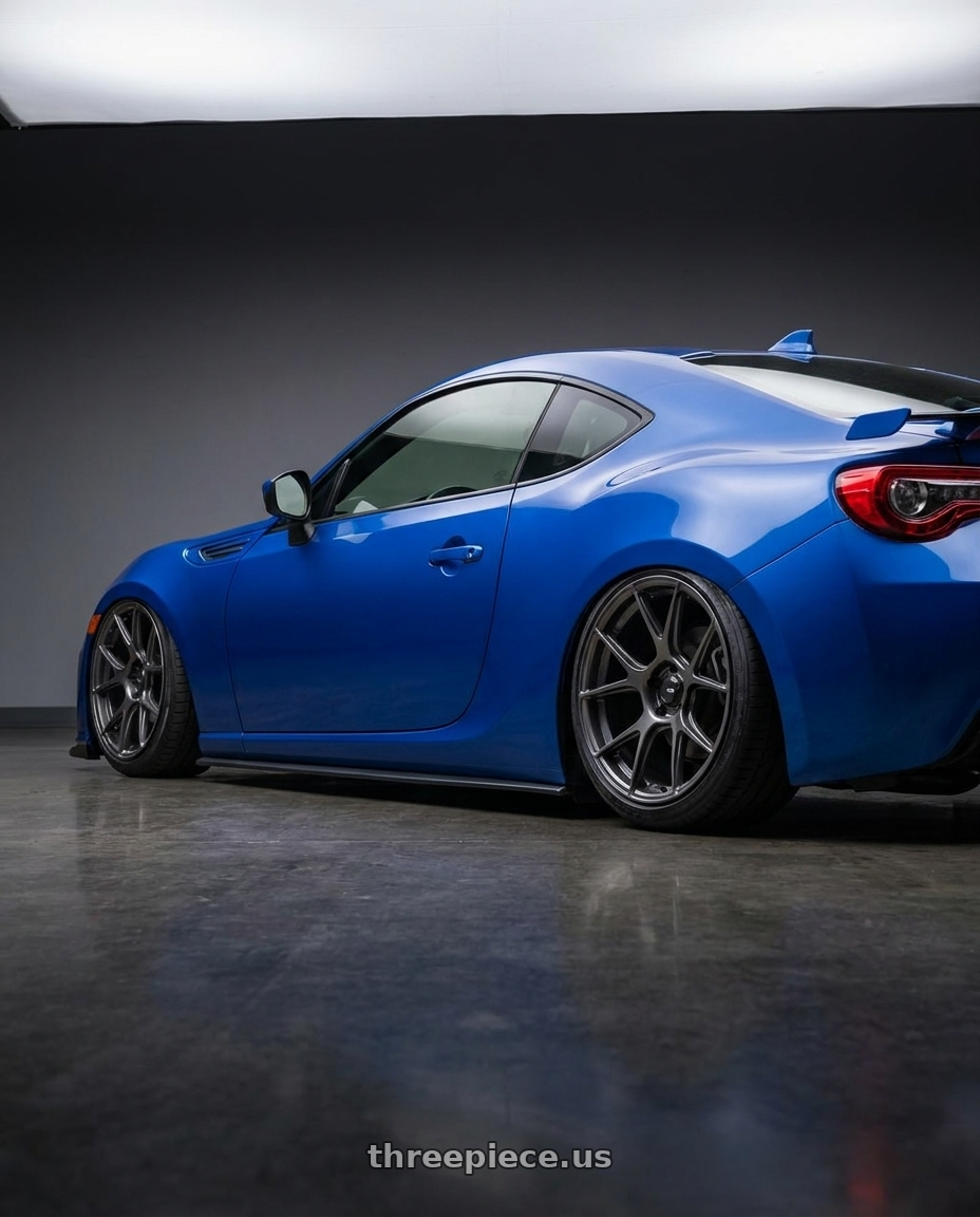 2017 Subaru BRZ with Konig Ampliform 5x100 17x9+40 Dark Metallic Graphite wheels rear three quarter view slight stretch tires