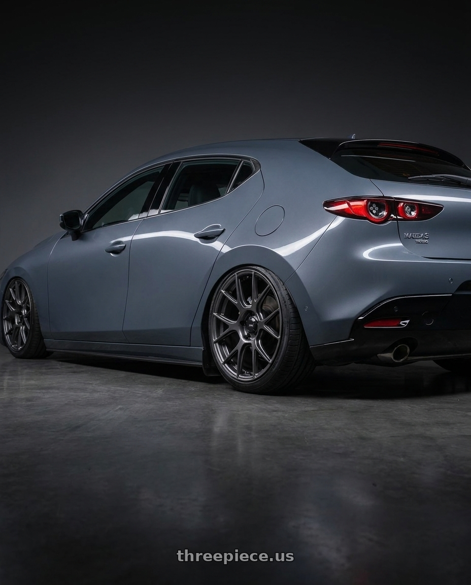 2023 Mazda Mazda3 Turbo with Konig Ampliform 5x114.3 18x9.5+35 Dark Metallic Graphite wheels rear three quarter view slight stretch tires