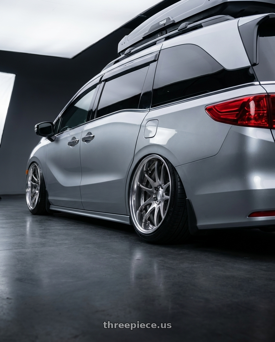 2024 Honda Odyssey with Work Cr 2P 5x120 20x8.5 +45 GT Silver wheels rear three quarter view extreme stretch tires
