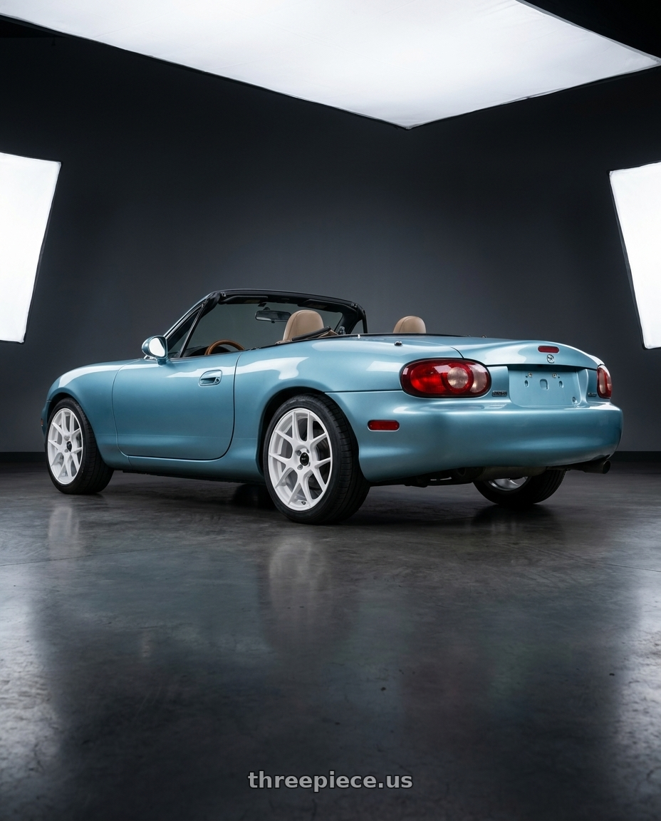 2002 Mazda Miata with Vors LT27 4x100 15x7  +40 White wheels rear three quarter view square tires