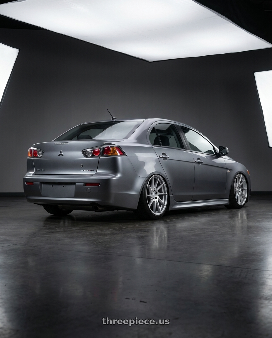2014 Mitsubishi Lancer Ralliart with Aodhan AH09 5x114.3 18x8.5 +35 Gloss Silver Machined Face wheels rear three quarter view slight stretch tires