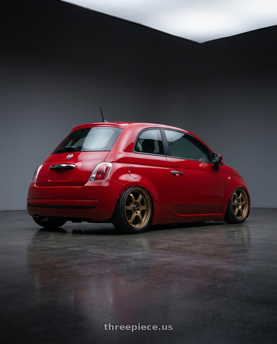 2014 Fiat 500 with Vors LT61 4x98 15x7 +35 Bronze wheels rear three quarter view slight stretch tires