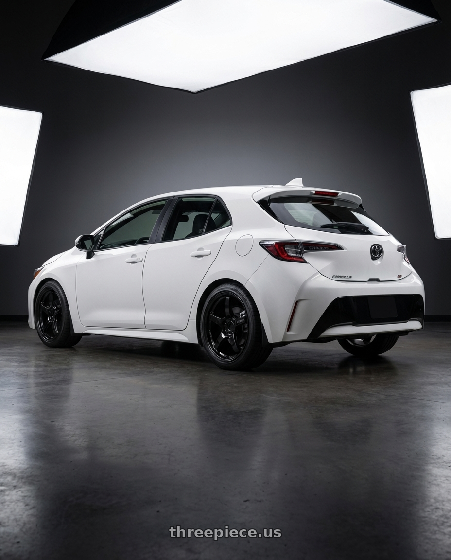 2023 Toyota Corolla Hatchback with Gram Lights 57CR 5x114.3 18x10.5+12 Glossy Black wheels rear three quarter view square tires