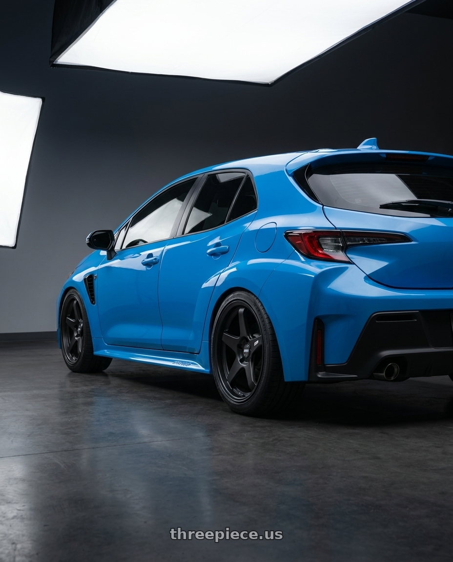 2024 Toyota GR Corolla with ESR Wheels APEX SERIES AP5 5x114.3 18x9.5 +22 Matte Black wheels rear three quarter view square tires