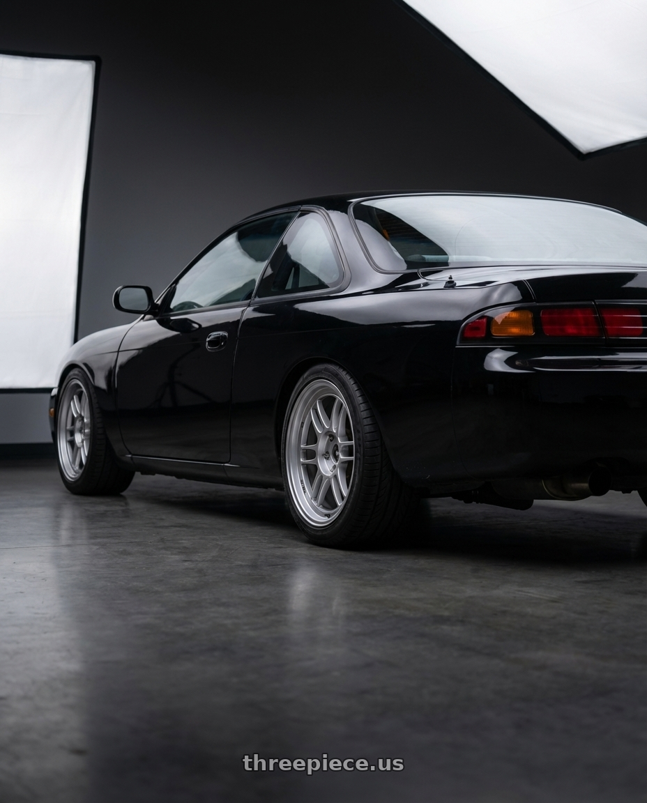 1997 nissan 240sx  with Enkei RPF1 5x114.3 18x9.5+38 Silver wheels rear three quarter view square tires