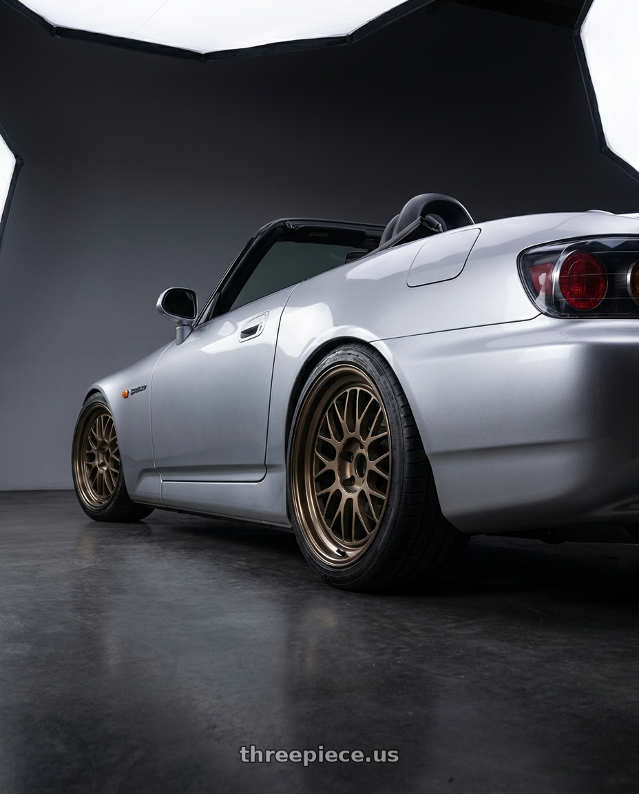 2000 Honda S2000 with Volk Racing 21A 5x114.3 18X8.5+34  Bronze wheels rear three quarter view square tires
