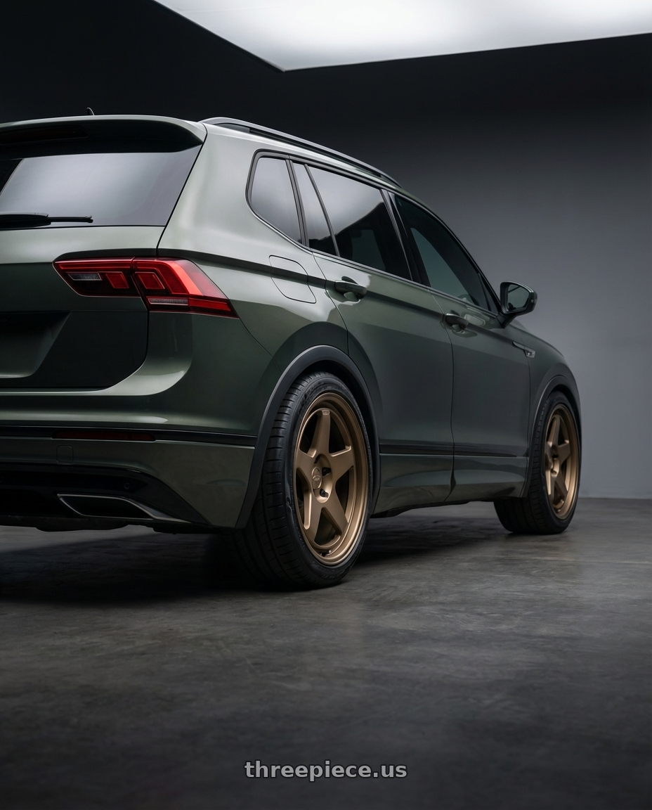 2016 VW Tiguan turbo with Kansei K12B KNP 5X100 18x9 12 Bronze wheels rear three quarter view square tires