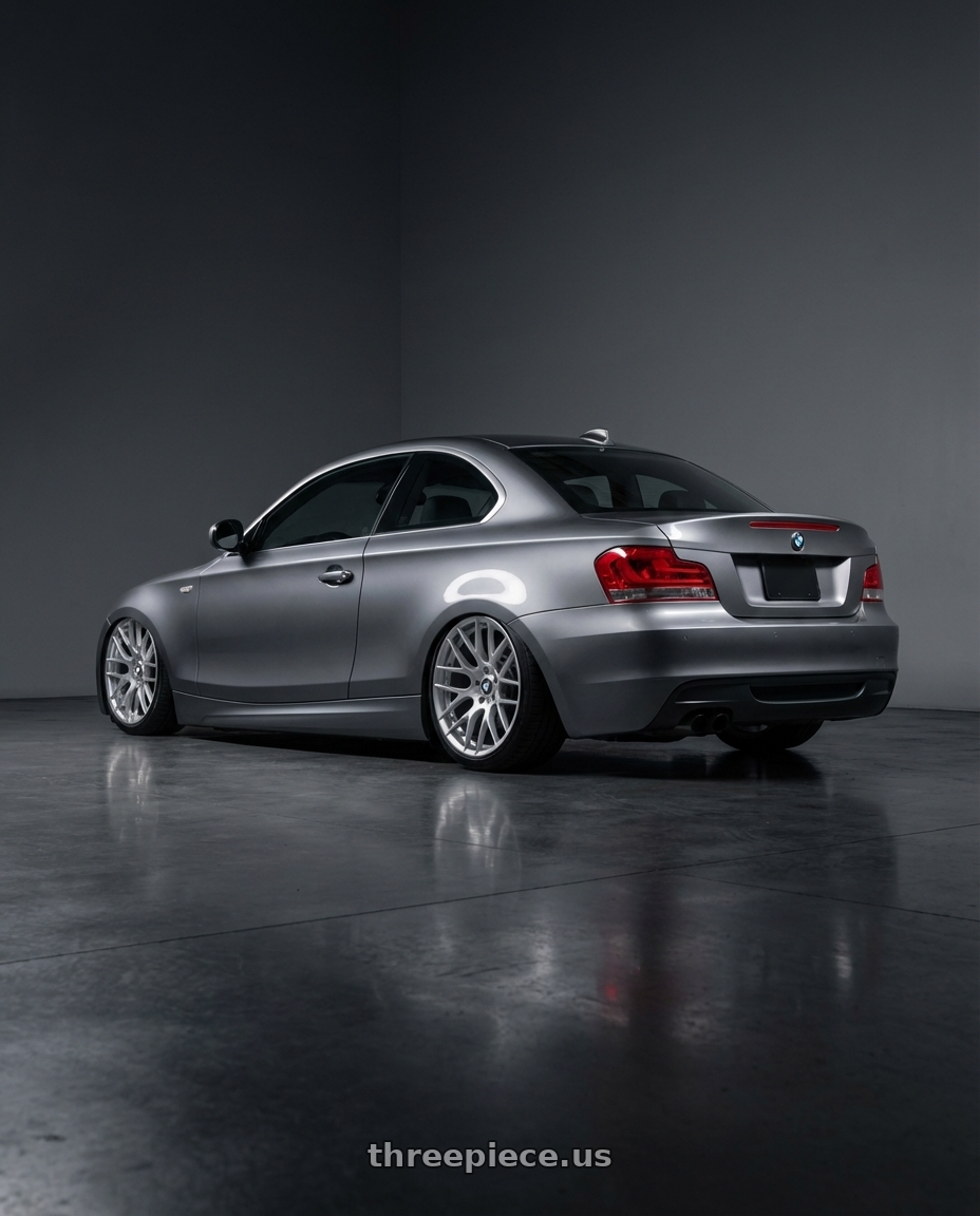 2012 BMW 1 Series E82 with Avant Garde Wheels M359 5X120 19x9 +18 Hyper Silver wheels rear three quarter view slight stretch tires