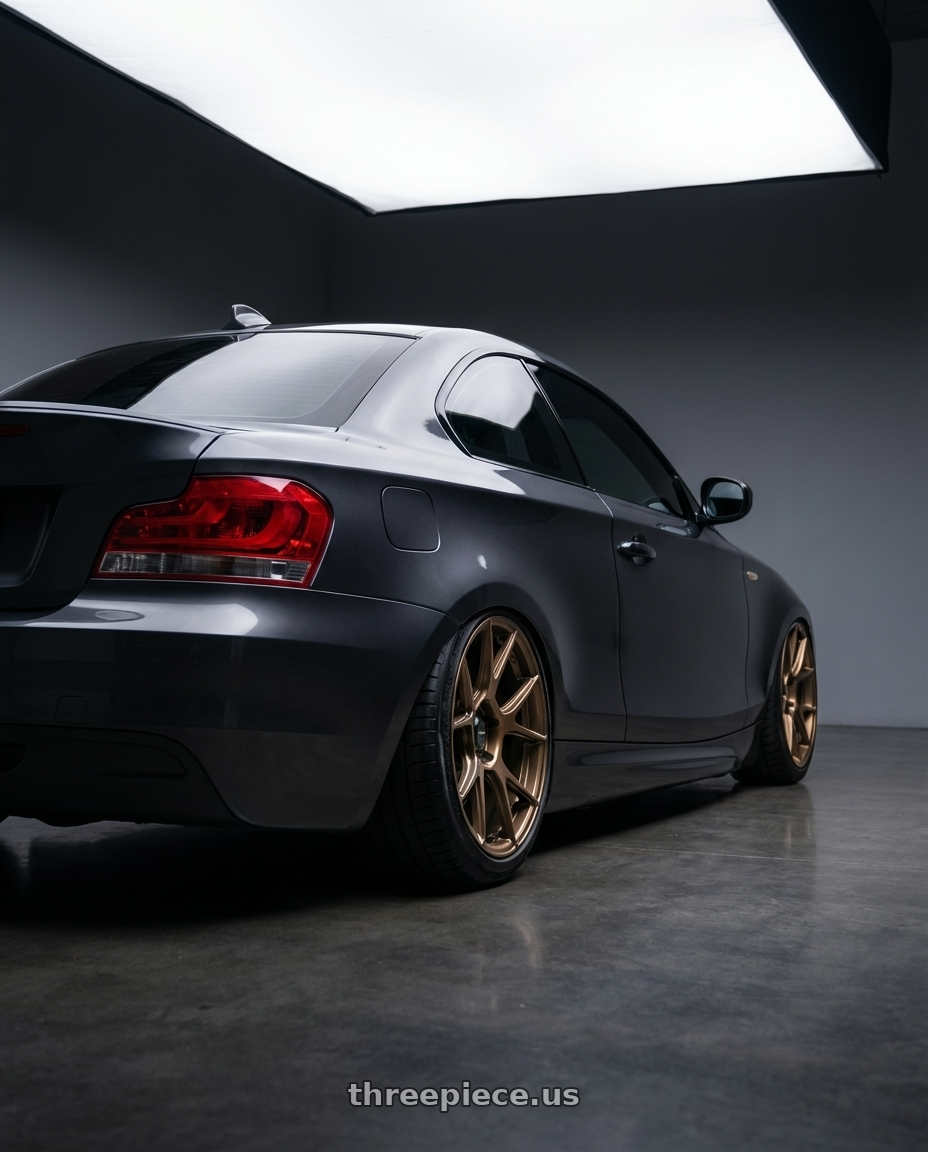 2012 BMW 1 Series E82 with Konig Ampliform 5x120 19x10+28 Gloss Bronze wheels rear three quarter view slight stretch tires