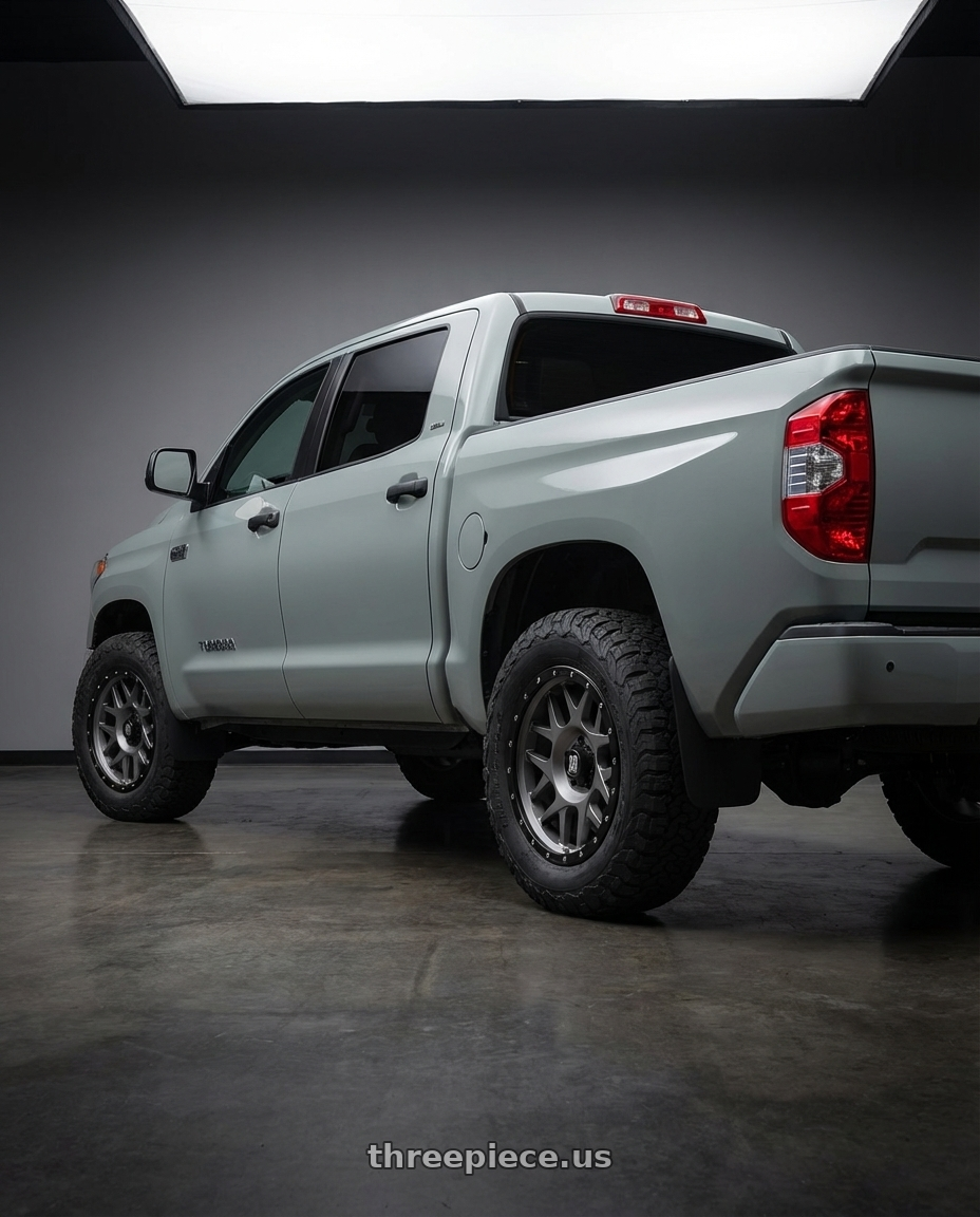 2018 Toyota Tundra with XD XD127 BULLY 5X150 20X9 +18 MATTE GRAY BLACK RING wheels rear three quarter view meaty tires