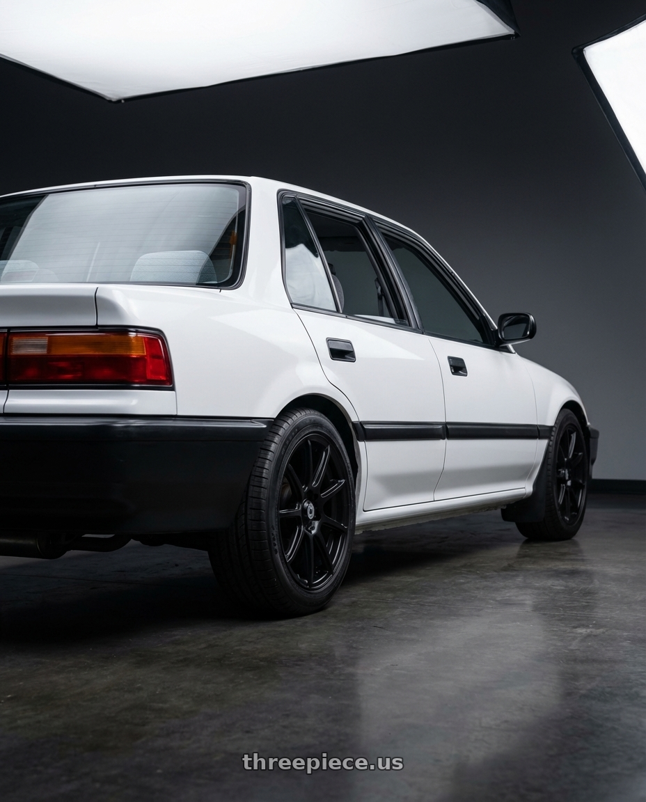 1988 Honda Civic DX, Whitr with Konig Control 4x100/4x114.3 15x6.5+40 Matte Black wheels rear three quarter view square tires