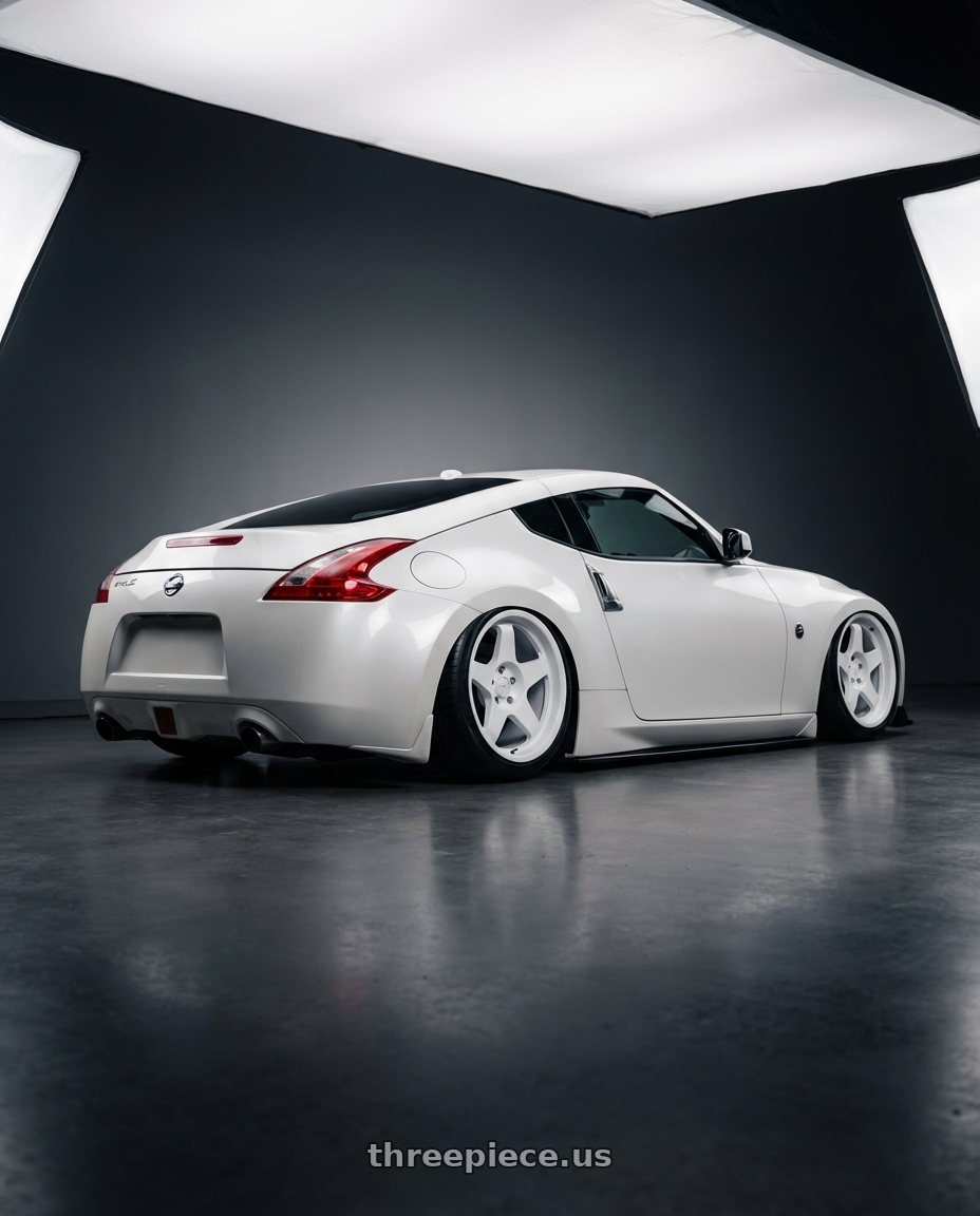 2019 Nissan 370Z with fifteen52 CHICANE 5x114.3 / 5x120 19x8.5 +35 RALLY WHITE (GLOSS WHITE) wheels rear three quarter view slight stretch tires
