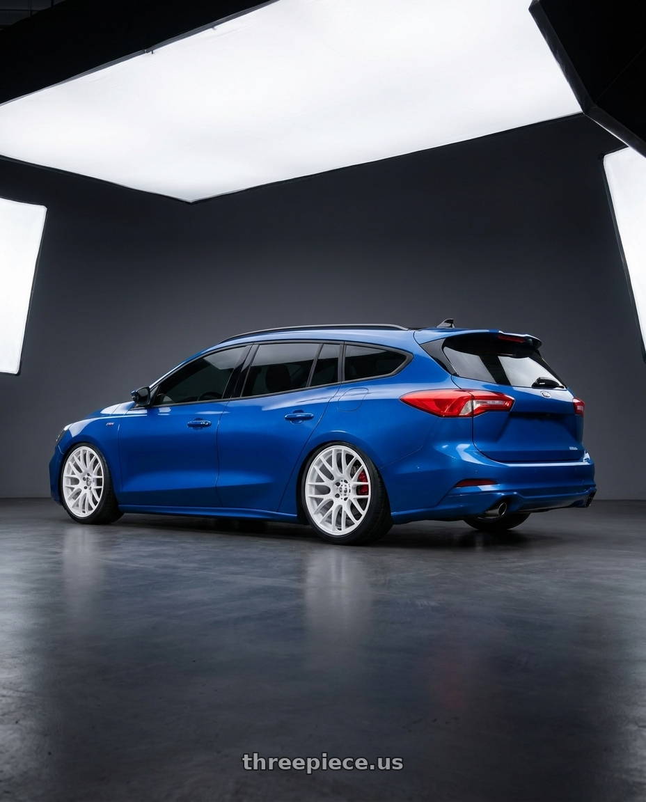 2024 ford focus wagon with Work Emotion m8r 5x100 19x8.5 +30 White wheels rear three quarter view extreme stretch tires