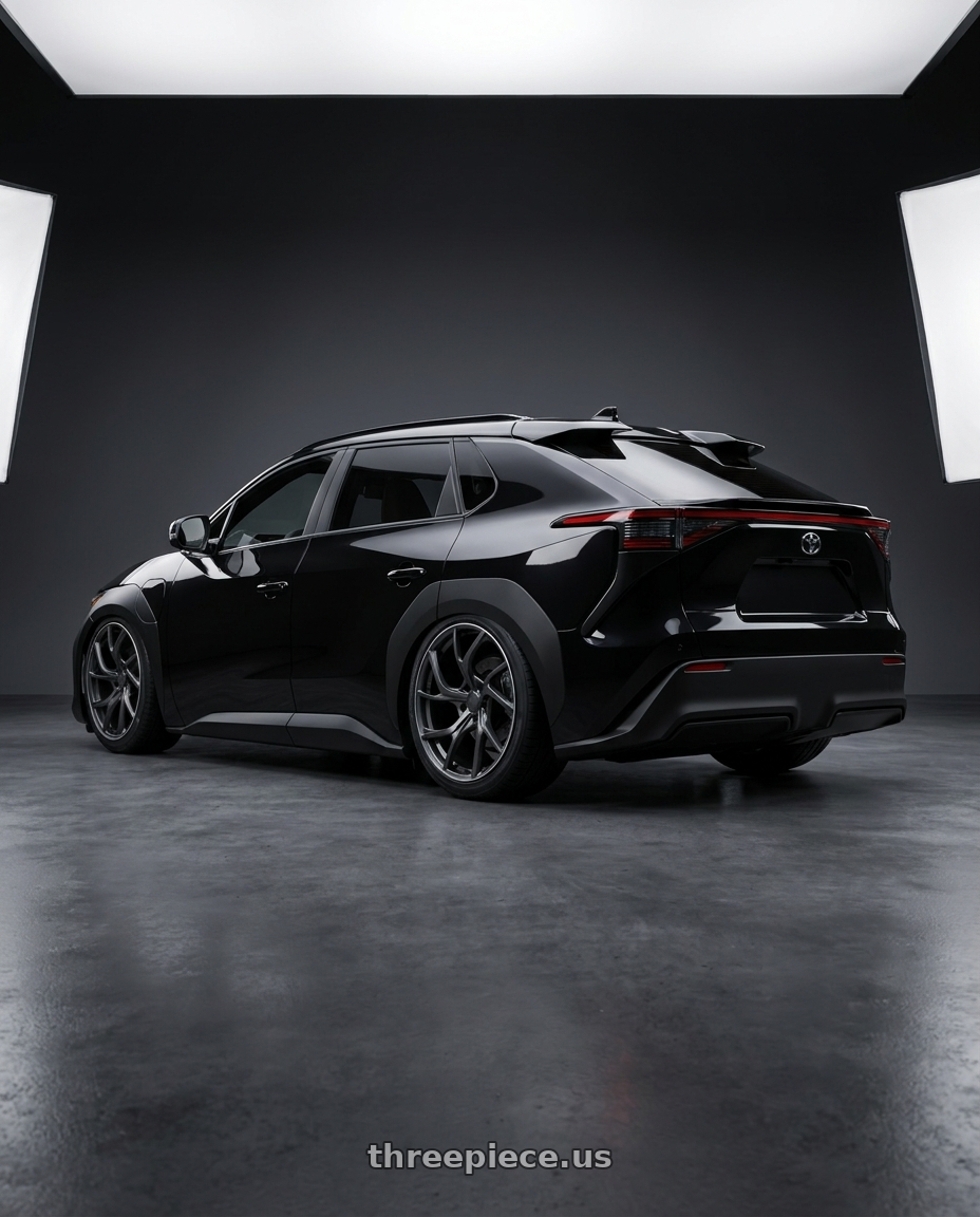 2026 Toyota BZ4X black with Volk Racing VERSUS VMF C-01 5x114.3 20x9.5 +28 MATTE GUNBLACK / DC wheels rear three quarter view square tires