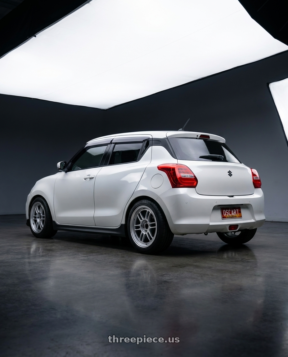 2024 Suzuki Swift with Enkei RPF1 5x114.3 16x8+38  Silver wheels rear three quarter view square tires