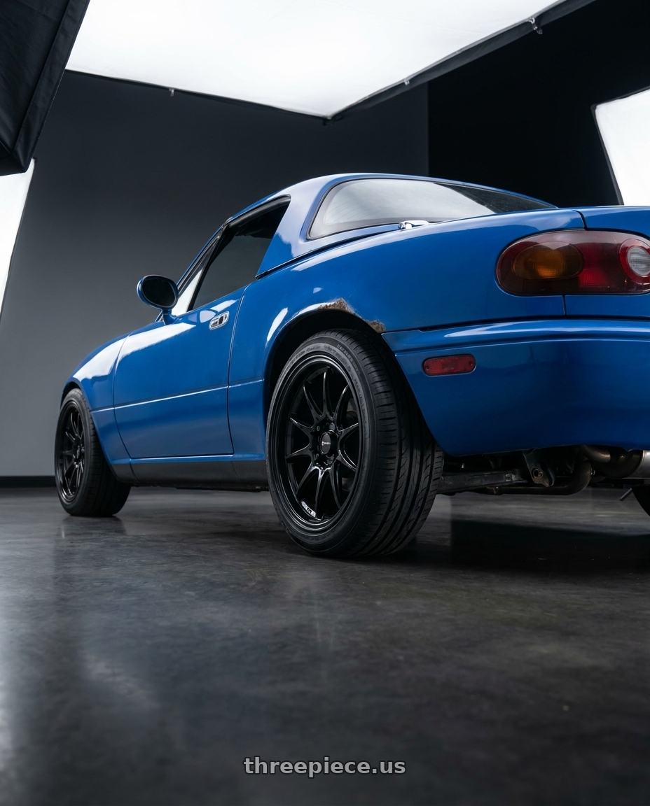 1993 Mazda mx5 Miata with Vors LT05 4x100 15x7  +40 Gloss Black wheels rear three quarter view square tires