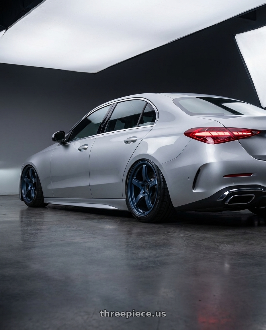 2022 Mercedes-Benz C-Class W206 with Gram Lights 57CR 5x112 19x9.5+25 Gunblue II wheels rear three quarter view slight stretch tires