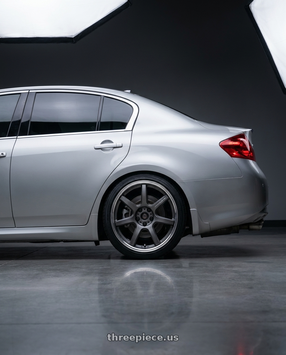 2013 infiniti g37x sedan with Work T7r 2P 5x114.3 19x9.5 +22 Matte Gunmetal wheels rear three quarter view square tires