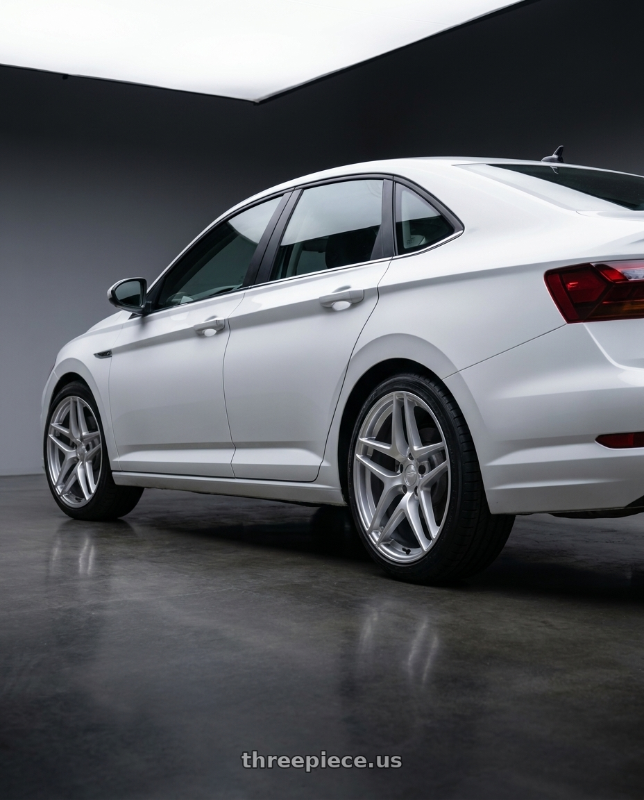 2026 volkswagen jetta with Kansei K15H Astro 5X112 19x8.5 35 Hyper Silver wheels rear three quarter view square tires