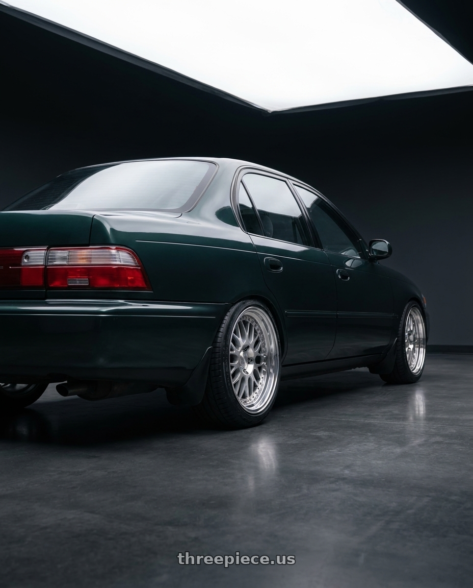 1997 toyota corolla with ARC AR1 5x108 17x9.5  +35 Silver Machine Face Lip Chrome Rivet wheels rear three quarter view square tires