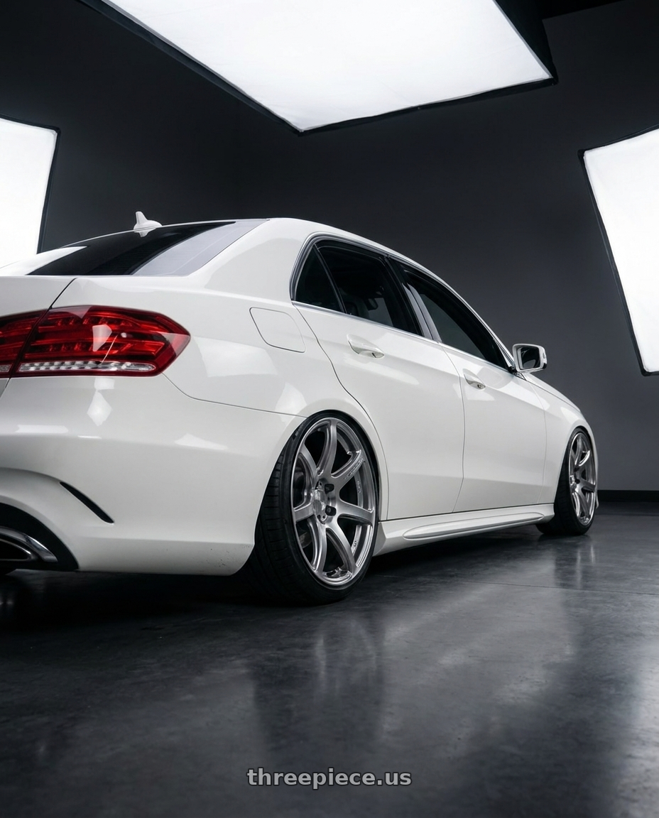 2014 Mercedes Benz e350 white with Work Emotion T7r 5x112 18x8.5 +30 Gt Silver wheels rear three quarter view slight stretch tires