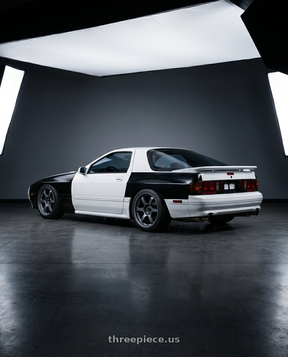 1990 Mazda RX7 with Gram Lights 57DR 5x114.3 18x10.5+12 Gunblue II wheels rear three quarter view square tires