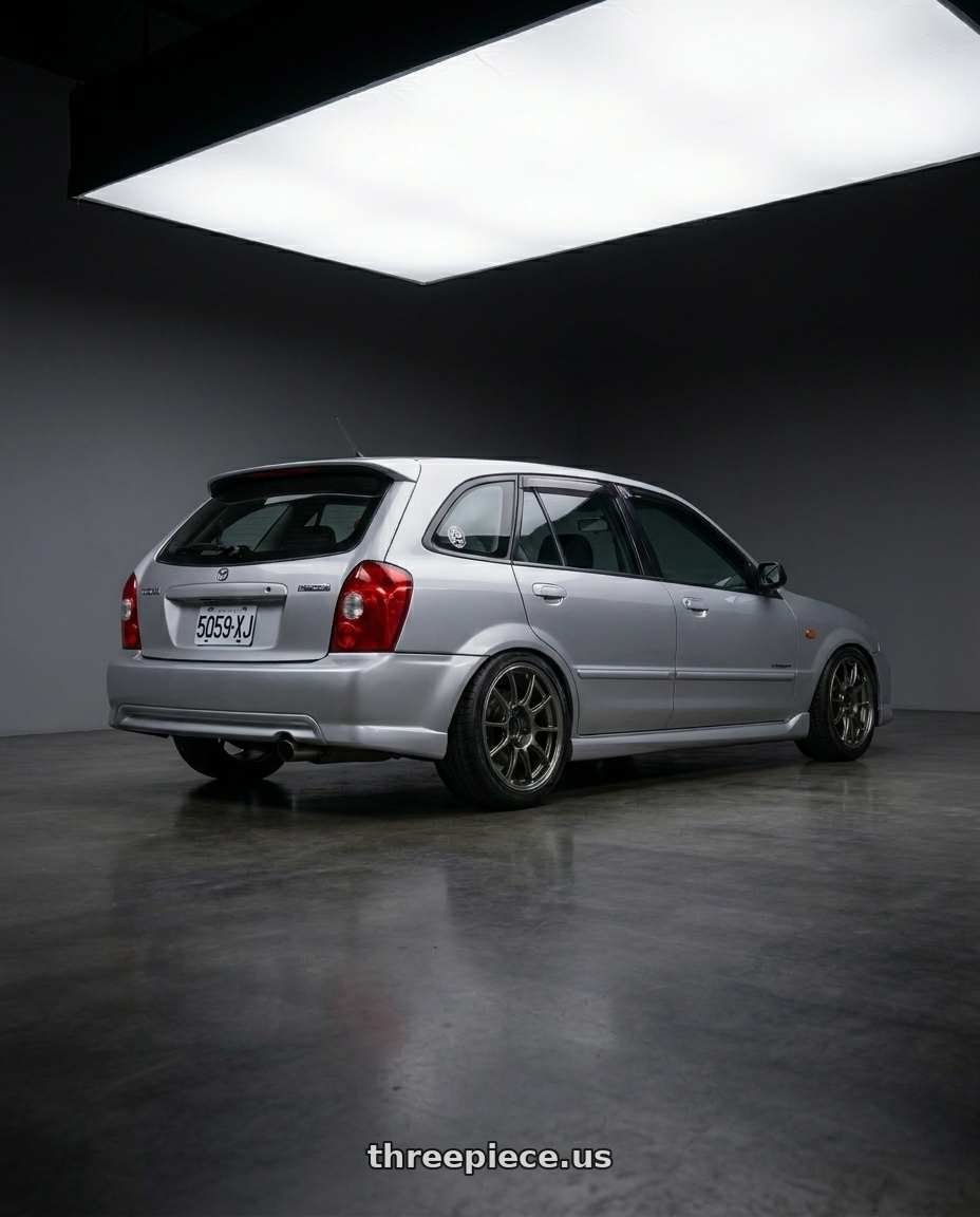 Mazda protege5 2000 with WedsSport TC105X 4x100 15x8.0+35 EJ Titan wheels rear three quarter view extreme stretch tires