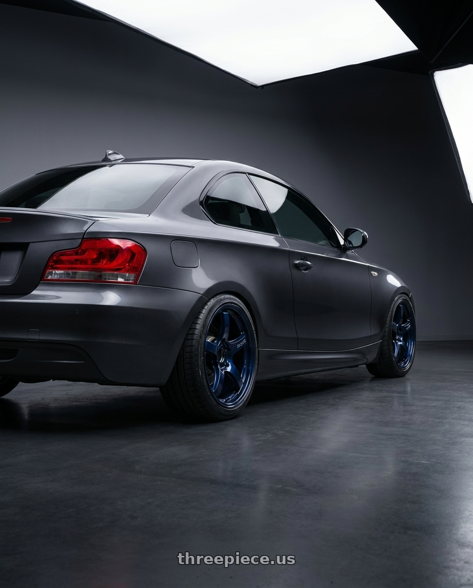 2012 BMW 1 Series E82 with Gram Lights 57CR 5x120 18x9.5+38 Eternal Blue Pearl wheels rear three quarter view square tires