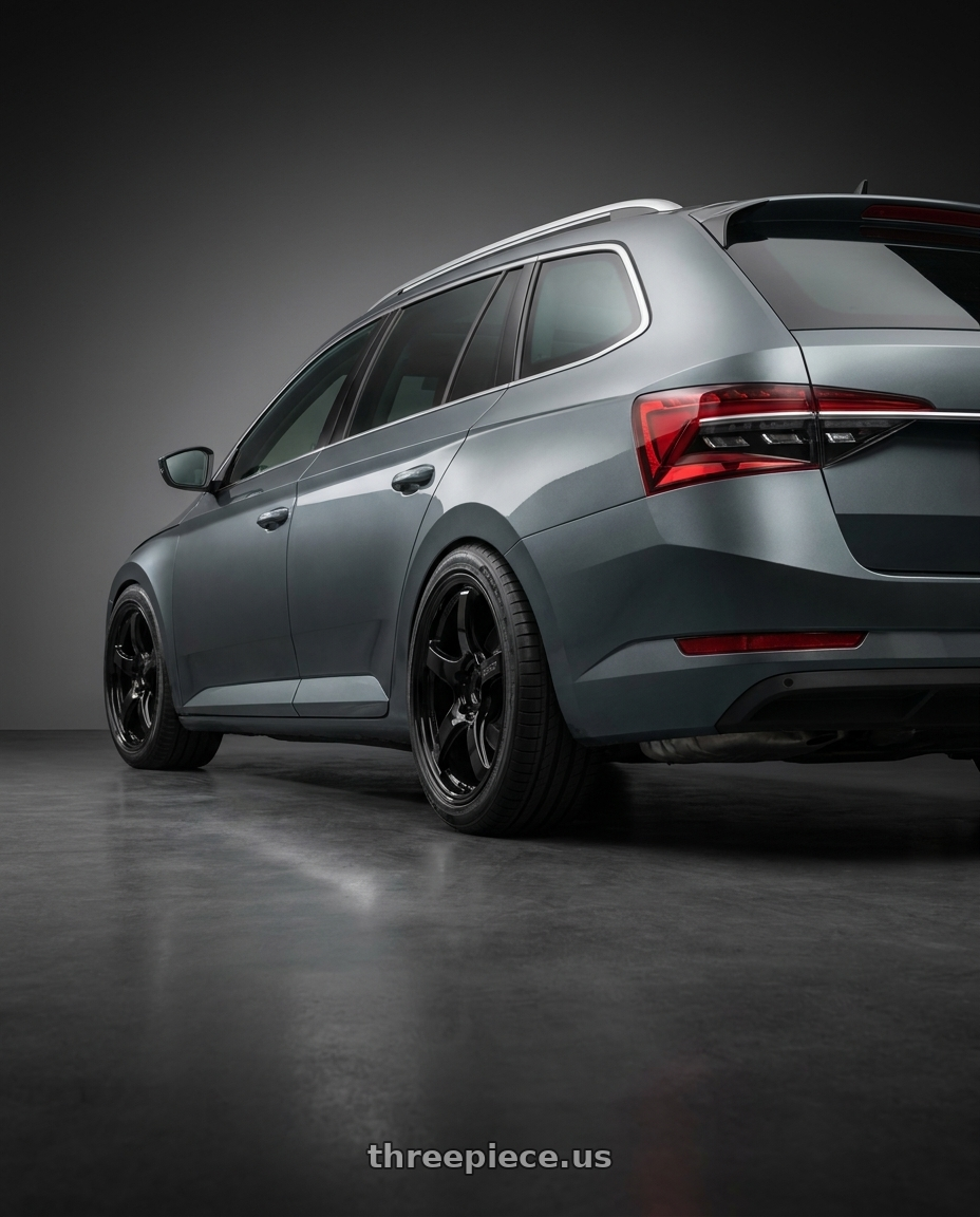 2021 Skoda Superb Combi with Gram Lights 57CR 5x100 18x8.5+45 Glossy Black wheels rear three quarter view square tires