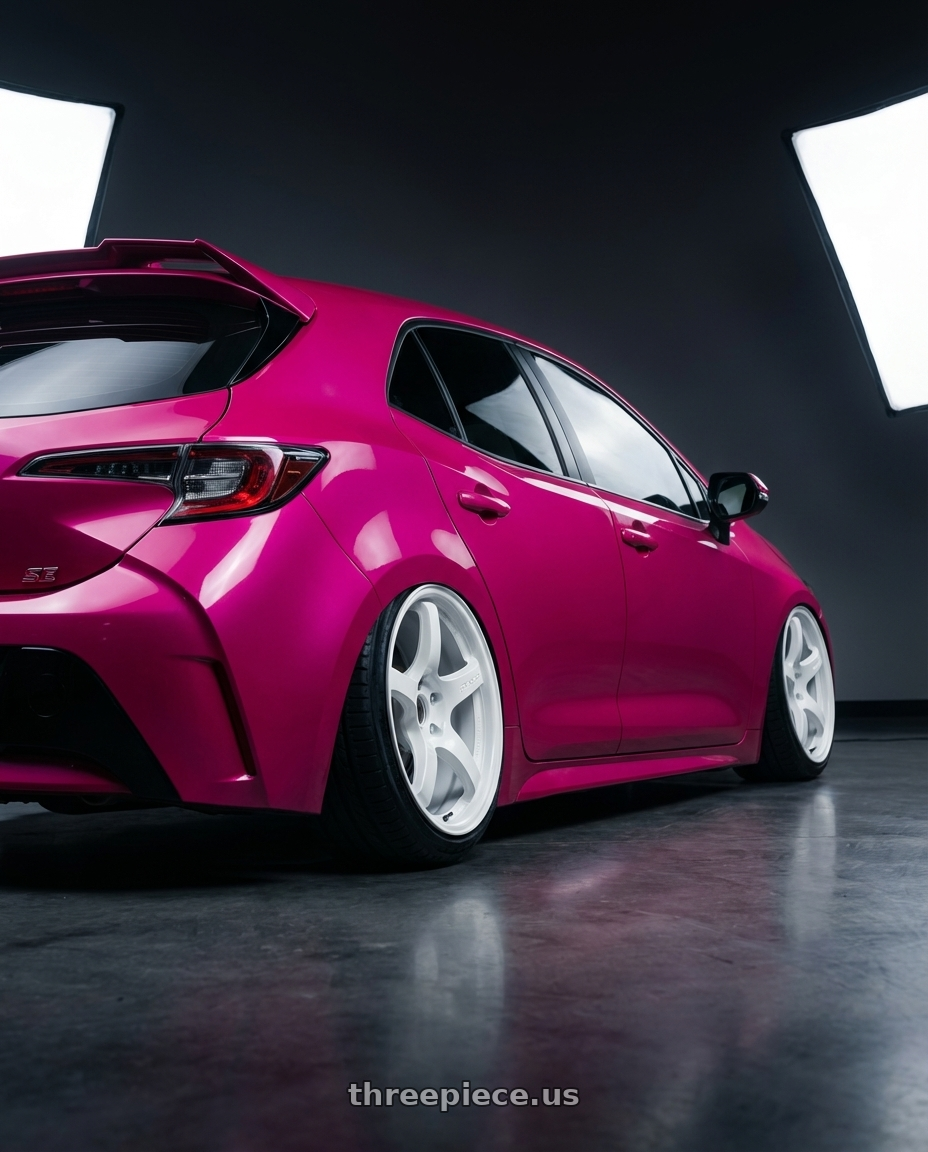 2019 Toyota Corolla Hatchback SE with Gram Lights 57CR 5x114.3 15x8+35 Ceramic Pearl wheels rear three quarter view extreme stretch tires