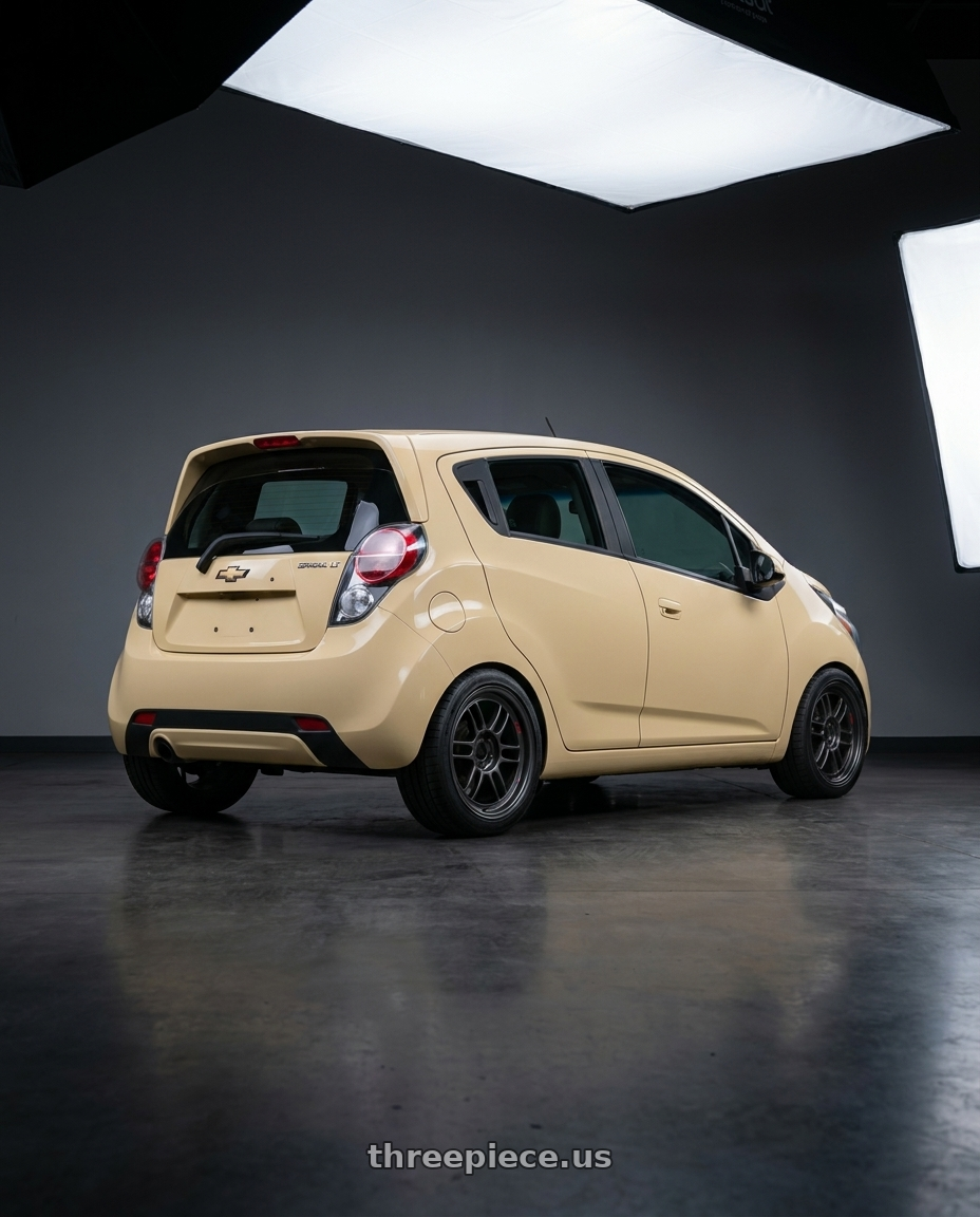 2015 Chevy Spark LT  with Enkei RPF1RS 5x114.3 18x9.5+12 Matte Gunmetal wheels rear three quarter view square tires